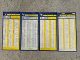 three michel michel timetables sitting on the ground