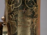 a close up of a gold vase with a clock on it