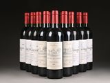 six bottles of red wine lined up in a row on a table
