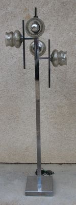 a lamp that is on top of a metal stand