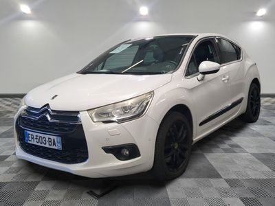 the white citrole is parked on a checkered floor