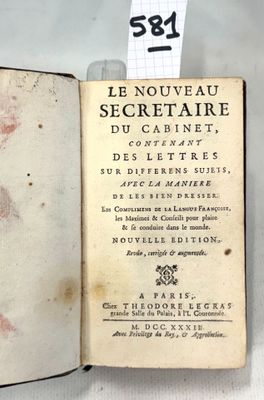 a book with writing on it sitting on a table