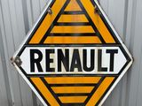 an orange and black sign sitting on the side of a building