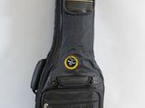 a guitar case that is sitting against a wall