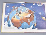 an open book with a picture of the earth on it