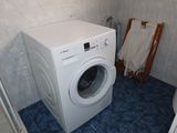 a washer and dryer in a small room