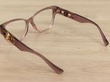 glasses on a table with a wooden surface and a wooden floor