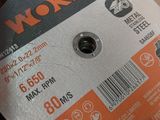 a picture of a metal grinding disc in a box