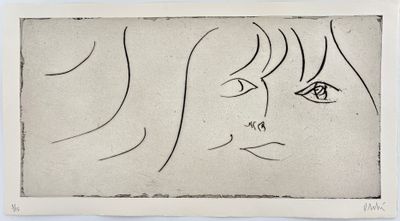 a drawing of a woman ' s face on a piece of paper