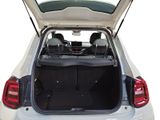 the back of a white car with the trunk open