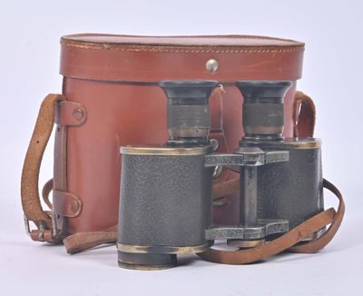 two binoculars sitting next to each other on a white surface