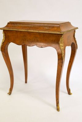 an image of a small wooden table with a drawer on it