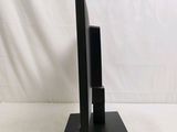 a black sculpture of a television on a stand