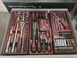 many tools in a tool box on the table