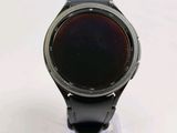 a smart watch sitting on a stand on a table