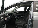 the interior of a car with the door open showing the driver ' s seat area