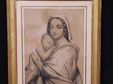 an old picture of a woman holding a baby in her arms