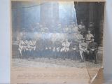 an old photo of a group of men in uniform posing for a picture