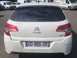 a white citrole parked in a parking lot