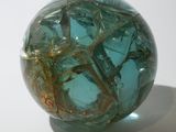 a glass ball that is sitting on a table