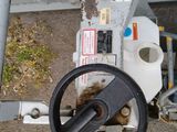 a steering wheel of a machine that is sitting on the ground