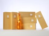 bottles of champagne and boxes on a white surface with a white background