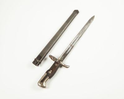 pair of old swords on a white surface with a white background