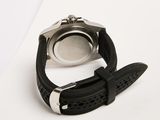 the watch is black and silver on a white surface
