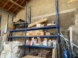 a blue shelf filled with lots of items in a room