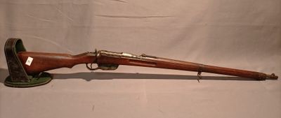 an old rifle with a wooden barrel and a wooden case