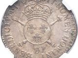 a close up of a coin with a crown on it