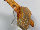 a piece of wood with a remote control on it