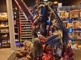 a statue of a man holding a sword in a store
