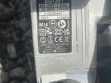 a picture of a close up of a machine on the ground