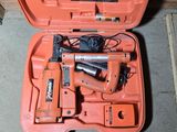 an orange tool case with tools in it on the floor