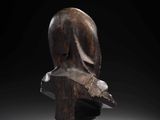 an image of a wooden sculpture of a man ' s head