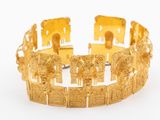 an image of a gold bracelet on a white background