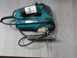 a small electric tool that is on a table