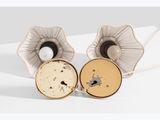 pair of silver and gold plated flower cufflinks with black and white accents