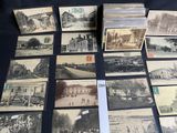 several old black and white photographs of people and buildings on a table