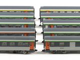 four train cars that are stacked on top of each other