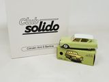 an image of a green toy car sitting next to a box