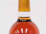 an image of a bottle of wine sitting on top of a table