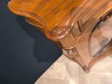 a wooden table with a mirror on top of it