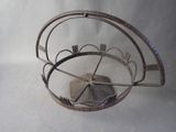 a metal basket that has a fan inside of it