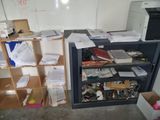 a desk with a bunch of papers and a printer