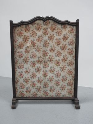 a close up of a fireplace screen with flowers on it