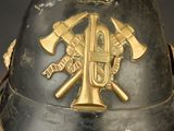 a close up of a helmet with two axes on it