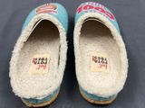 pair of women ' s wool slippers with colorful designs on them