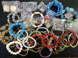 a lot of bracelets and bracelets that are on a table